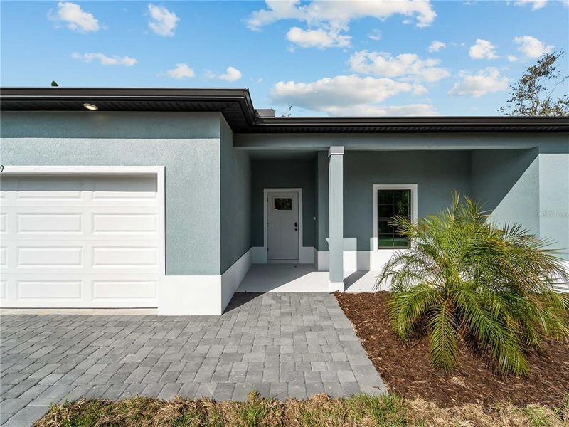 Exterior details and patio area of a home in , North Port (Image 36).