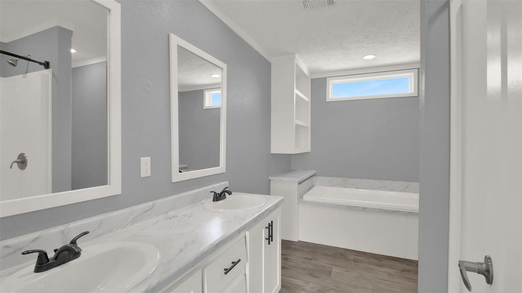 Clean lines and a spacious dual vanity define this modern bathroom retreat.