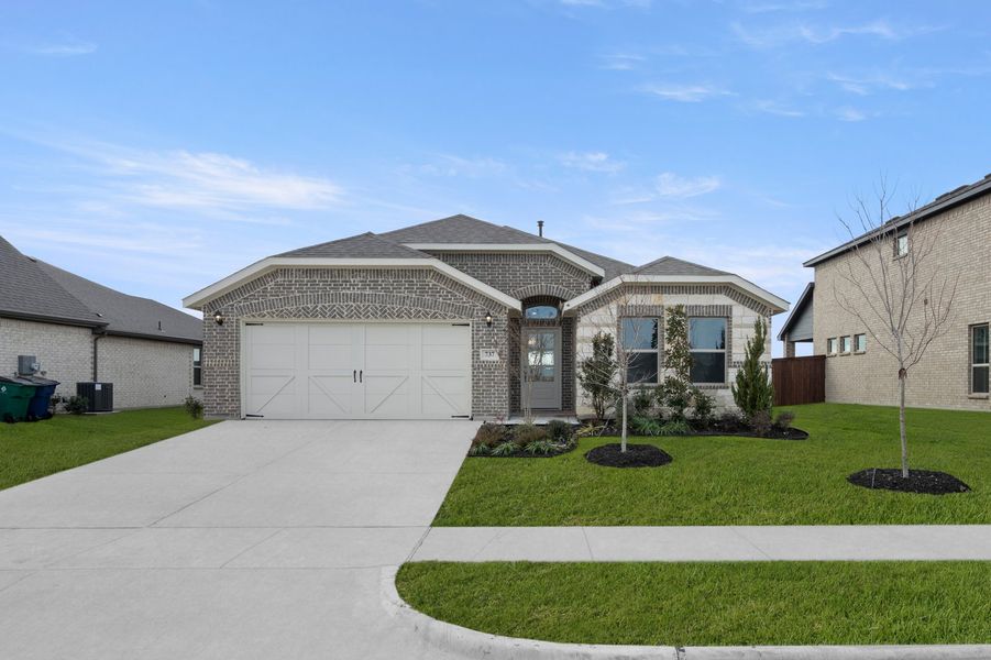 Front exterior of a new home in Myrtle Creek, Waxahachie, TX, highlighting curb appeal (Image 1). Front exterior of a new home in Myrtle Creek, Waxahachie, TX, highlighting curb appeal (Image 1).