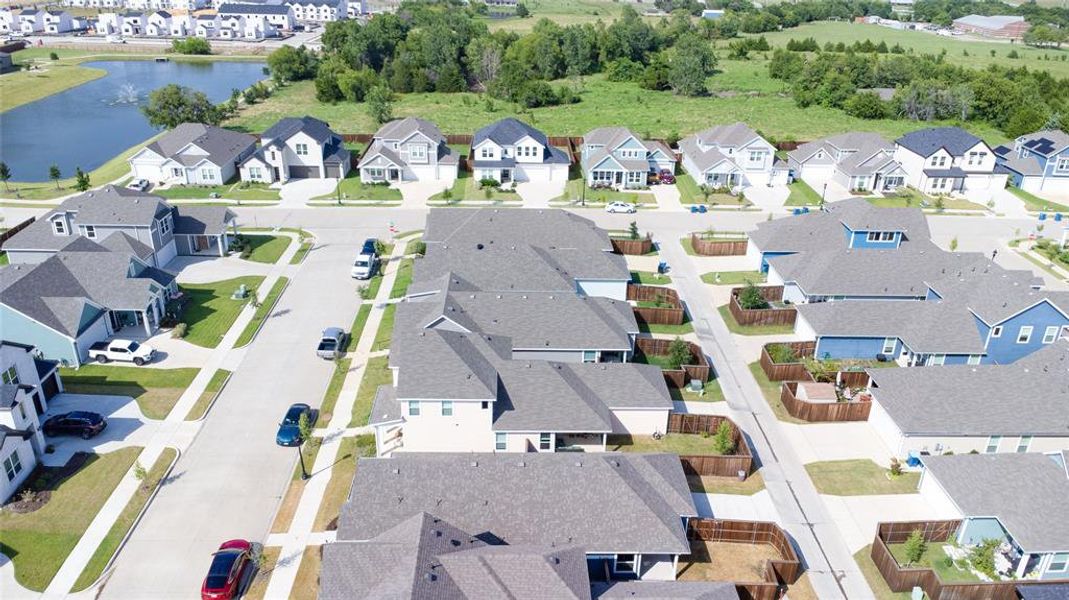 Aerial overview of property's location featuring nearby suburban area and a large body of water