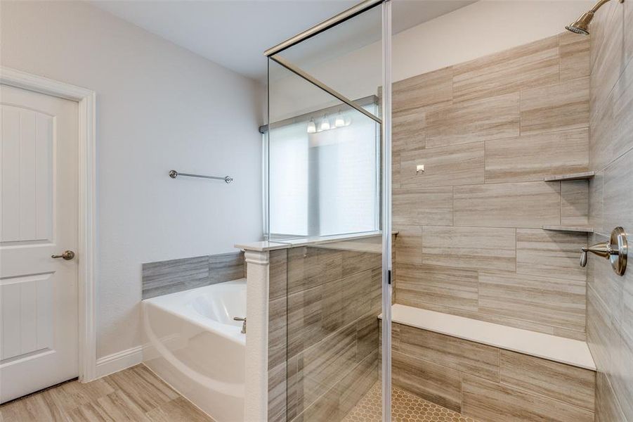 Bathroom with a bath and tiled shower