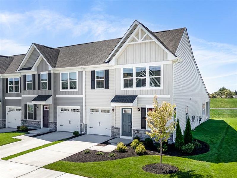 Front exterior of a new home in Hope Pointe, North Myrtle Beach, SC, highlighting curb appeal (Image 1). Front exterior of a new home in Hope Pointe, North Myrtle Beach, SC, highlighting curb appeal (Image 1).