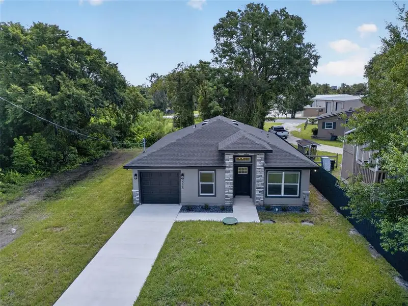 Front exterior of a new home in , Sanford, FL, highlighting curb appeal (Image 1). Front exterior of a new home in , Sanford, FL, highlighting curb appeal (Image 1).