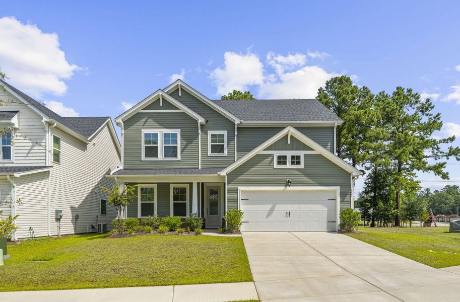 Front exterior of a new home in The Groves of Berkeley, Moncks Corner, SC, highlighting curb appeal (Image 24).