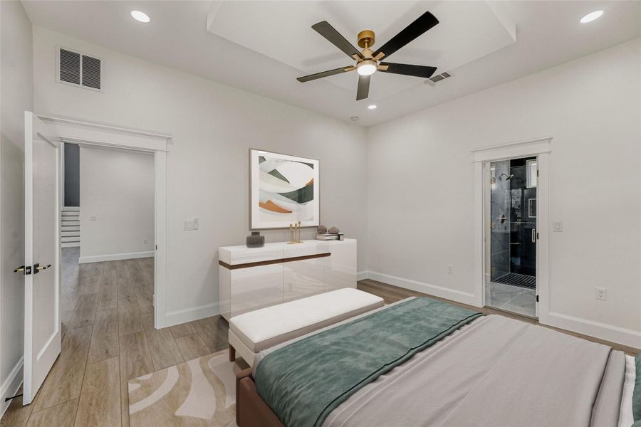 Featuring soaring high ceilings, recessed lighting, a designer ceiling fan, and a luxury ensuite bath. (virtually staged photo)