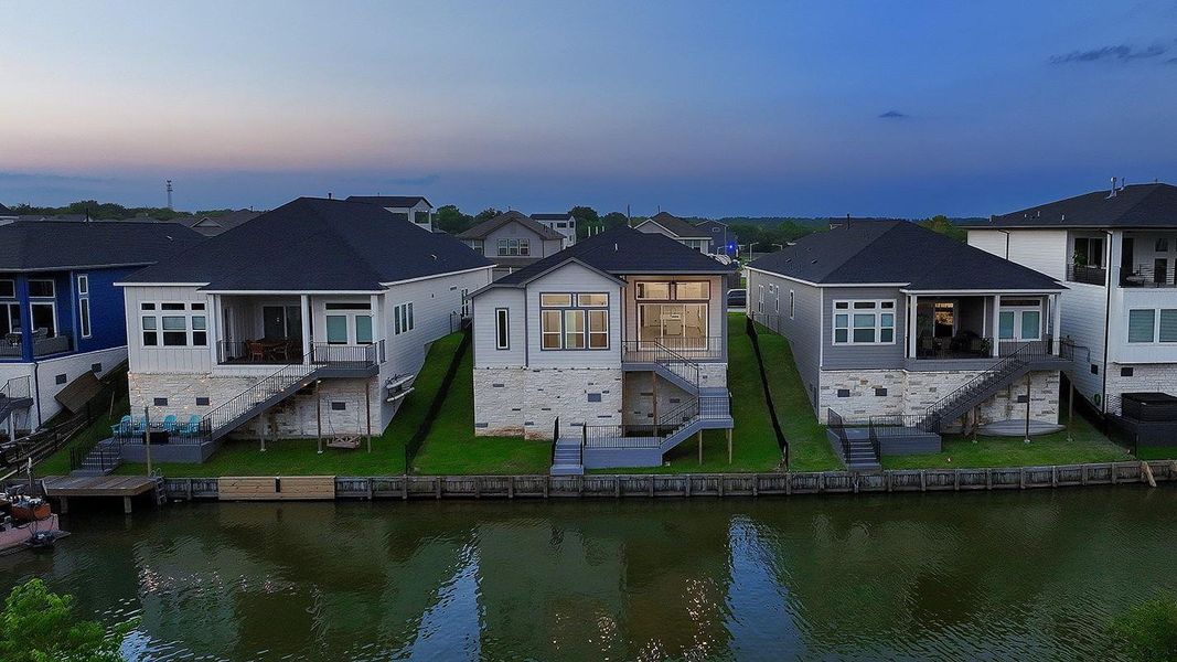 Exterior details and patio area of a home in Lake Breeze, Willis (Image 27).