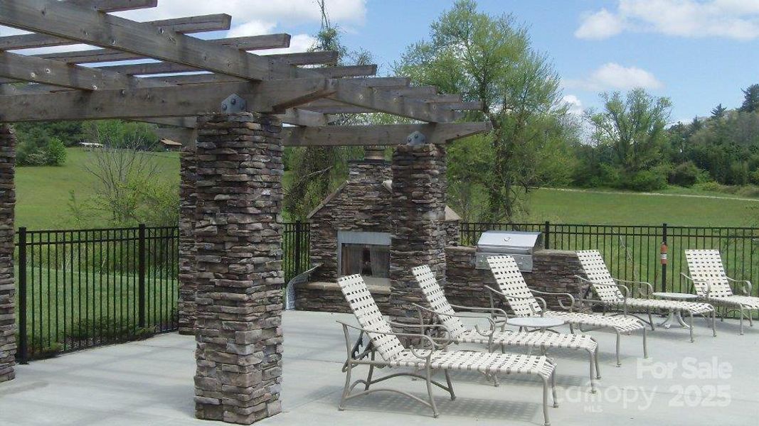 Club house has pool with outside fireplace and grill Club house has pool with outside fireplace and grill