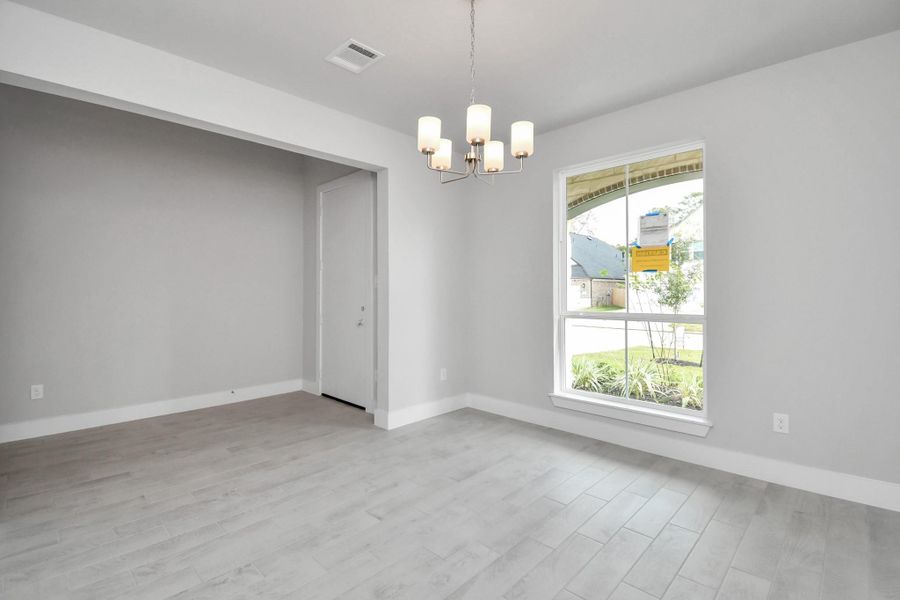 Make memories gathered around the table with your family and friends! This spacious dining room features elegant flooring, custom paint, and adjacent to family room and kitchen for open concept feel. Sample photo of completed home with similar floor plan. Actual colors and selections may vary. Make memories gathered around the table with your family and friends! This spacious dining room features elegant flooring, custom paint, and adjacent to family room and kitchen for open concept feel. Sample photo of completed home with similar floor plan. Actual colors and selections may vary.