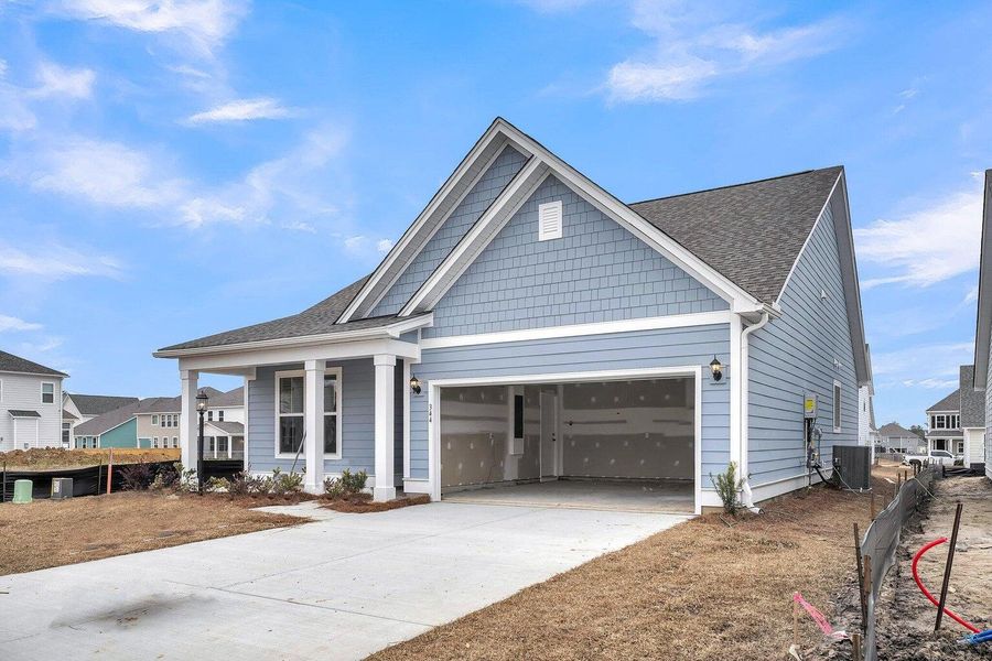 Front exterior of a new home in Abbey Walk, Moncks Corner, SC, highlighting curb appeal (Image 2).