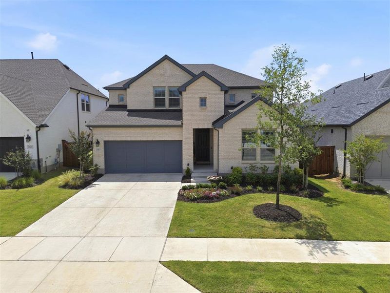 Front exterior of a new home in The Parks at Wilson Creek, Celina, TX, highlighting curb appeal (Image 1). Front exterior of a new home in The Parks at Wilson Creek, Celina, TX, highlighting curb appeal (Image 1).