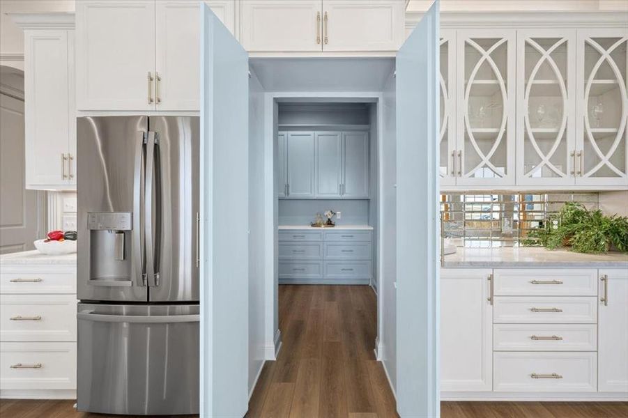 Entrance to pantry hidden behind cabintery Entrance to pantry hidden behind cabintery