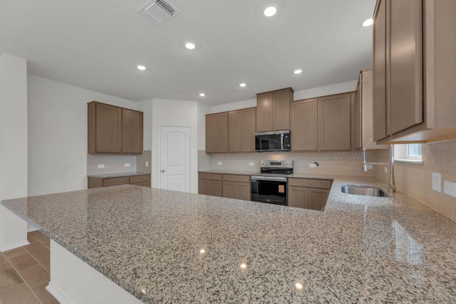 Furnished interior view inside a new home in Mustang Valley, Manor (Image 17).