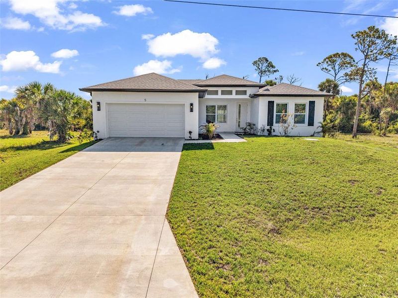 Front exterior of a new home in , Placida, FL, highlighting curb appeal (Image 29).