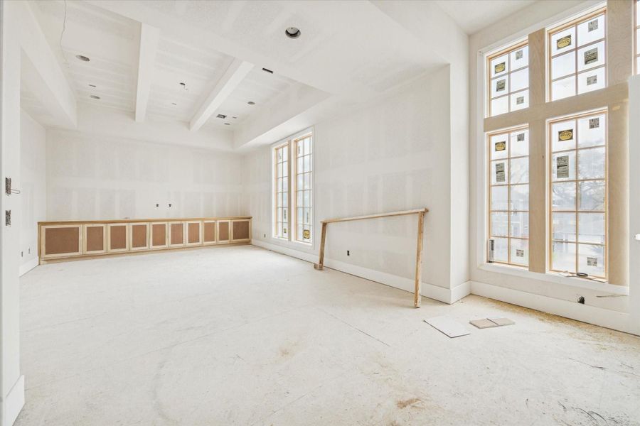 Expansive game room featuring soaring high ceilings and massive windows that fill the space with abundant natural light. This versatile second-floor retreat offers a spacious open-concept layout with sleek modern lines and premium finishes, providing the perfect environment for a home theater, play area, or secondary living space. The contemporary design highlights the exceptional craftsmanship and airy feel of this luxury residence. Expansive game room featuring soaring high ceilings and massive windows that fill the space with abundant natural light. This versatile second-floor retreat offers a spacious open-concept layout with sleek modern lines and premium finishes, providing the perfect environment for a home theater, play area, or secondary living space. The contemporary design highlights the exceptional craftsmanship and airy feel of this luxury residence.