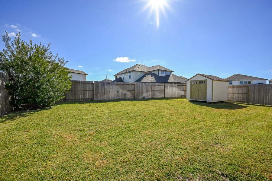 This well-maintained backyard offers a peaceful outdoor retreat framed by a full wooden privacy fence, ideal for relaxation, play, or gardening. This well-maintained backyard offers a peaceful outdoor retreat framed by a full wooden privacy fence, ideal for relaxation, play, or gardening.