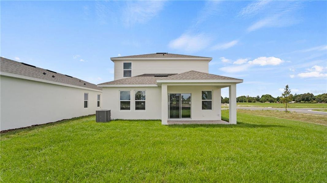 Front exterior of a new home in Willowbrook North, Winter Haven, FL, highlighting curb appeal (Image 21).