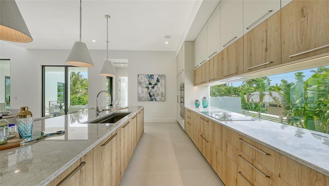 Kitchen with window backsplash