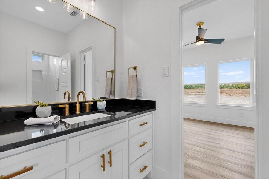 Bathroom with vanity and light wood-type flooring