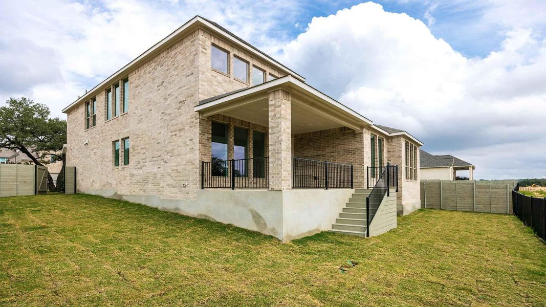 Exterior details and patio area of a home in Wolf Ranch 56', Georgetown (Image 3).