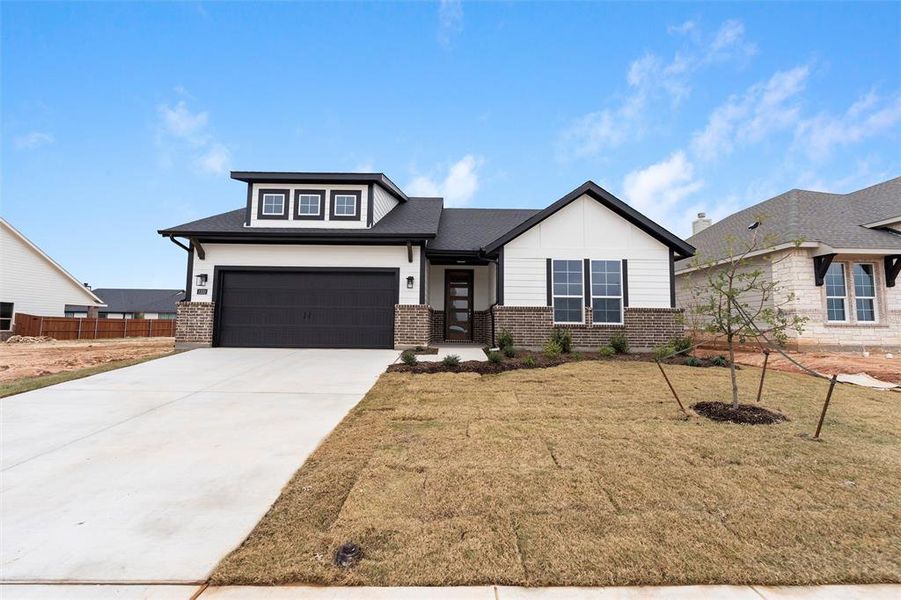 Front exterior of a new home in Covenant Park, Springtown, TX, highlighting curb appeal (Image 2).