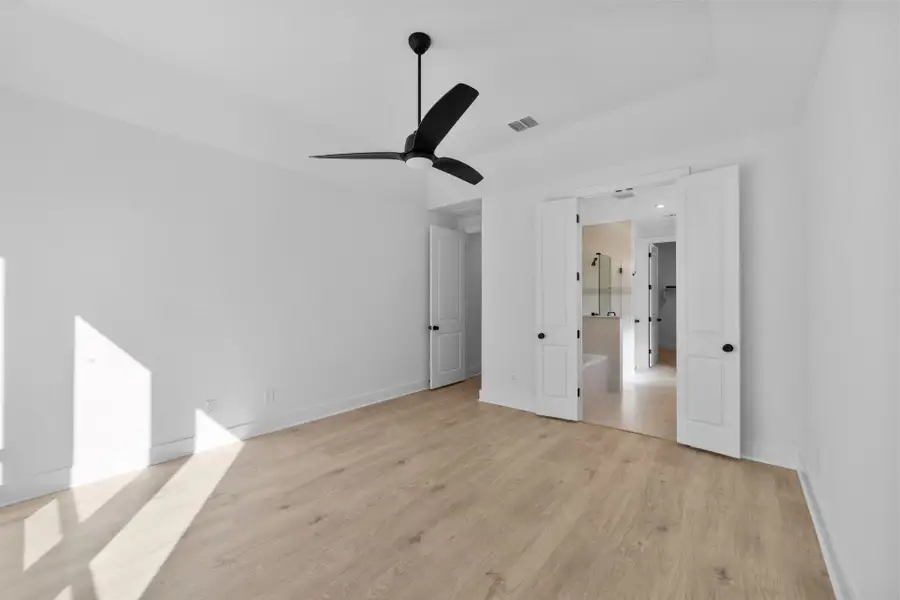 Primary Bedroom with elevated ceiling