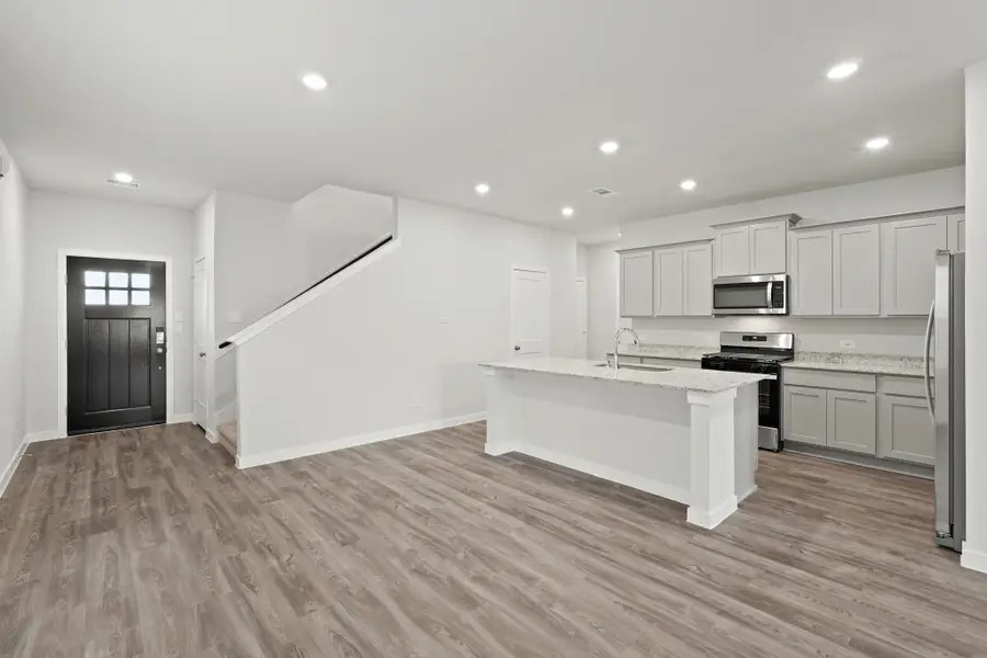 Spacious, unfurnished interior of a new home in Lonestar Collection at Paloma at Sanford Farms, Waller (Image 9).