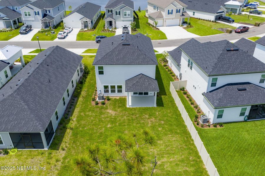Front exterior of a new home in Beacon Lake, St. Augustine, FL, highlighting curb appeal (Image 17).