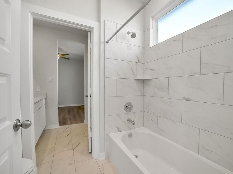 Furnished interior view inside a new home in Sunterra, Katy (Image 19).