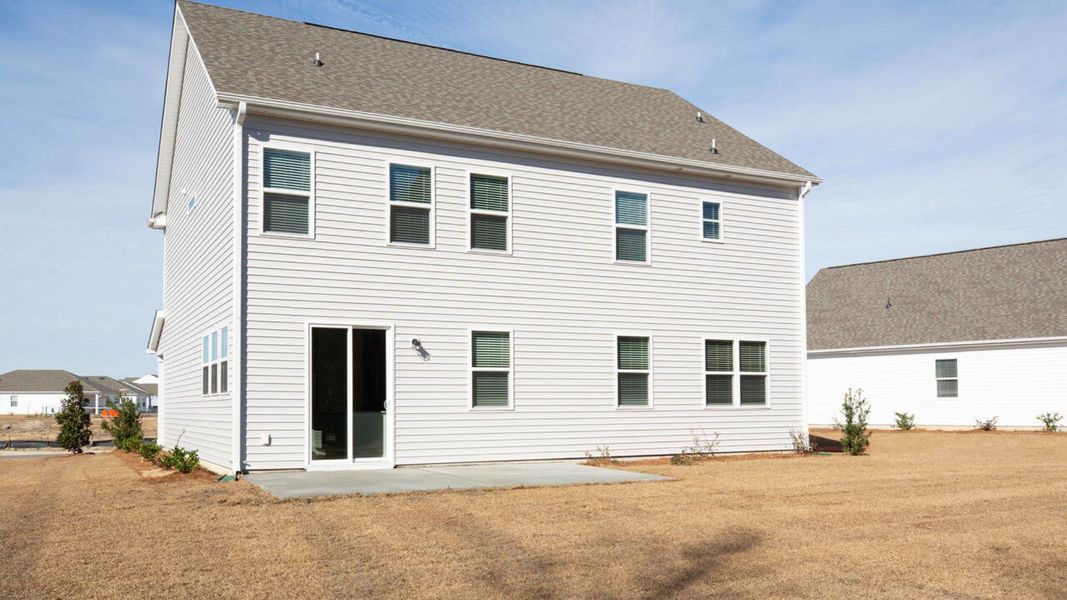 Exterior details and patio area of a home in Surfside Landing, Hubert (Image 2).