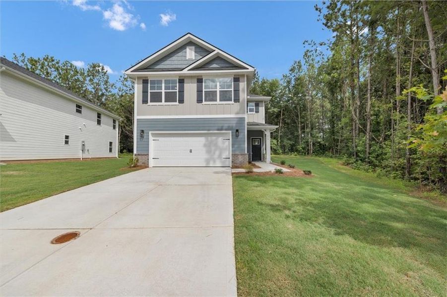 Front exterior of a new home in Canterbury Villas, Carrollton, GA, highlighting curb appeal (Image 18).