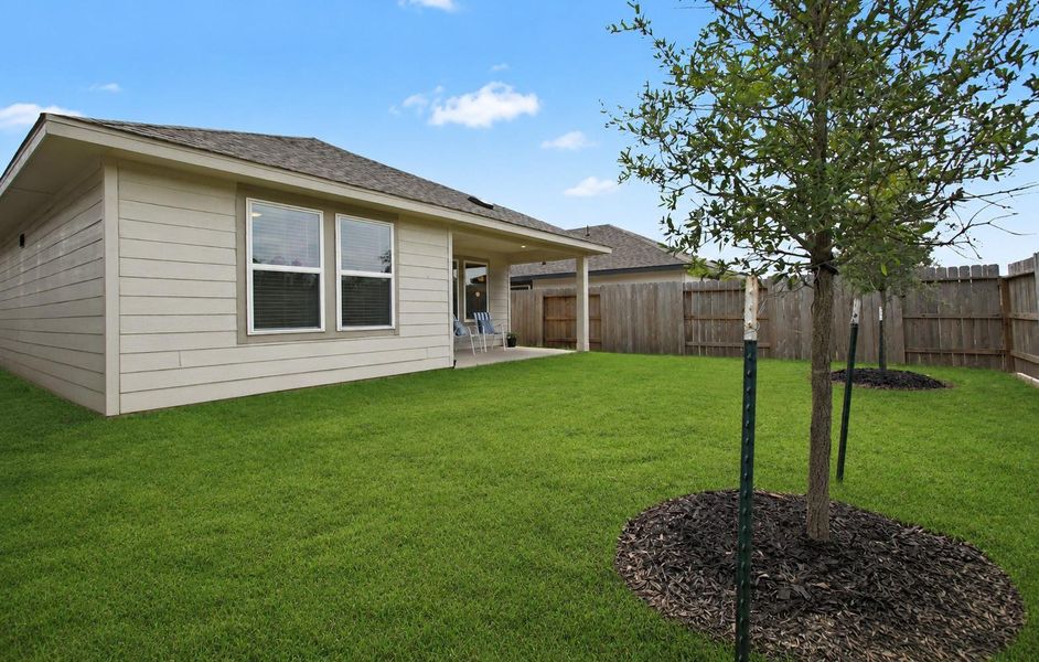 Beautifully landscaped backyard with space for the kids and pets to play and outdoor gatherings. Beautifully landscaped backyard with space for the kids and pets to play and outdoor gatherings.