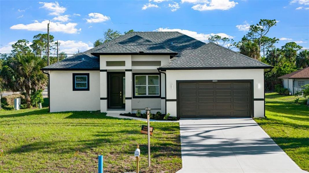 Front exterior of a new home in , Port Charlotte, FL, highlighting curb appeal (Image 1). Front exterior of a new home in , Port Charlotte, FL, highlighting curb appeal (Image 1).
