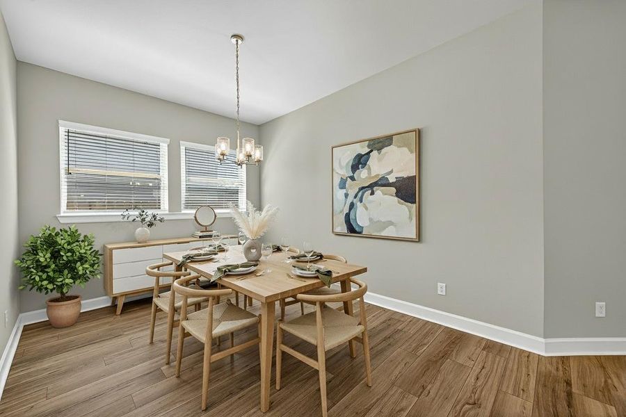 This beautifully virtually staged dining room boasts elegant decor, abundant natural light, and a modern, inviting atmosphere—perfect for hosting and creating memorable moments. This beautifully virtually staged dining room boasts elegant decor, abundant natural light, and a modern, inviting atmosphere—perfect for hosting and creating memorable moments.