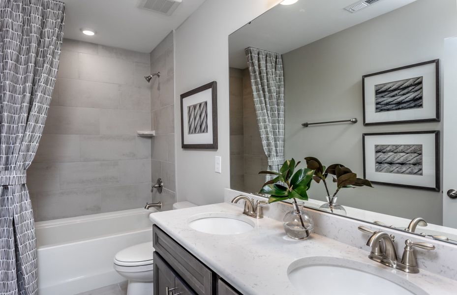 Guest Bathroom with Tub. Model Home Representation.