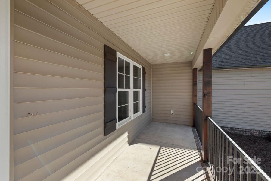 Charming covered front porch: perfect for sipping your morning coffee and decorating for every season. Charming covered front porch: perfect for sipping your morning coffee and decorating for every season.
