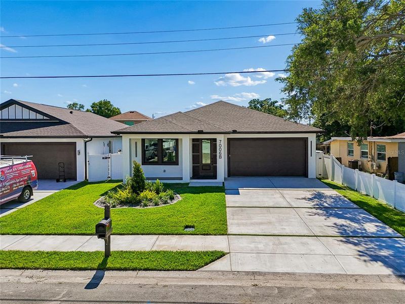 Front exterior of a new home in , Tampa, FL, highlighting curb appeal (Image 35).