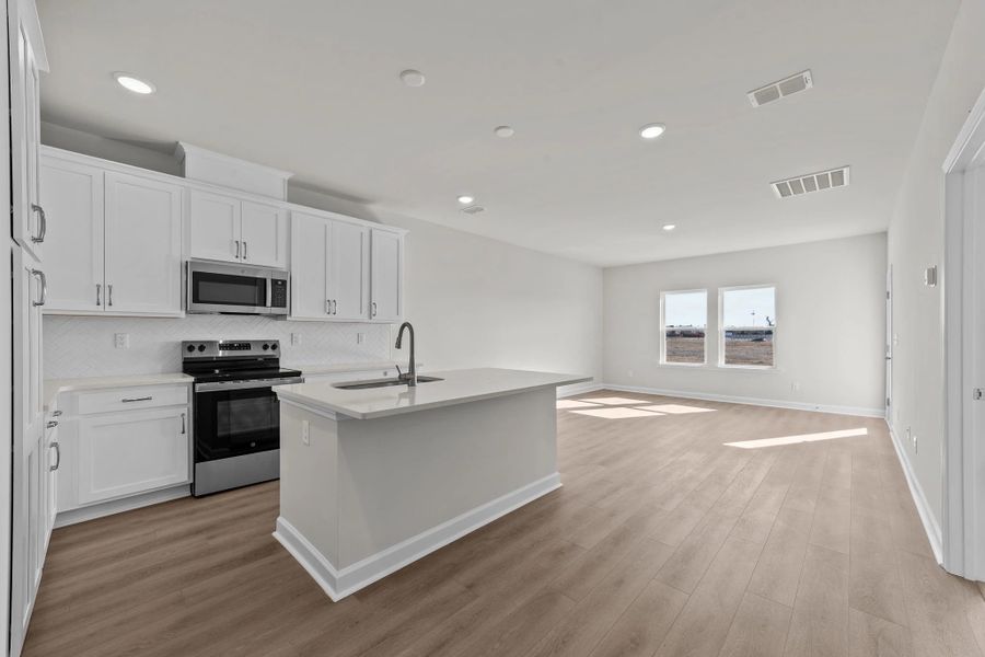 Furnished interior view inside a new home in Blue Heron Retreat: Villas, Little River (Image 7).