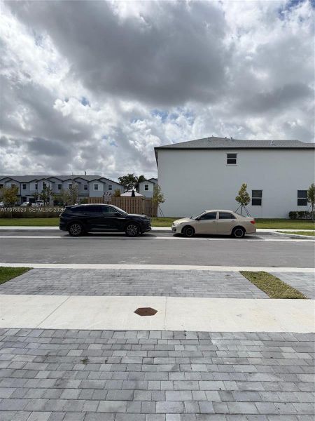 Front exterior of a new home in , Homestead, FL, highlighting curb appeal (Image 18).