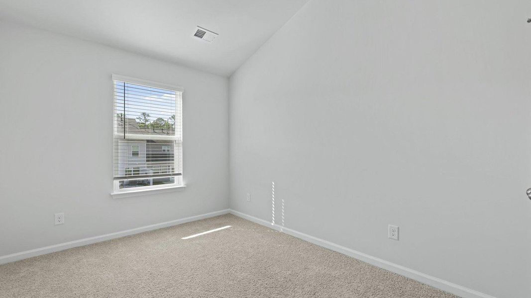 Spacious, unfurnished interior of a new home in Pine Hills Townhomes at Cane Bay, Summerville (Image 22).