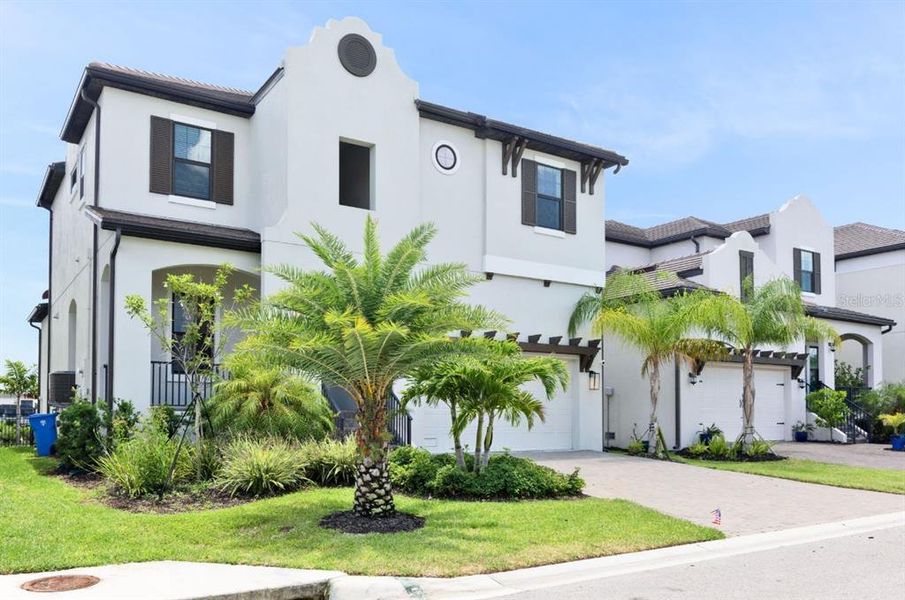 Front exterior of a new home in SouthShore Yacht Club, Ruskin, FL, highlighting curb appeal (Image 23). Front exterior of a new home in SouthShore Yacht Club, Ruskin, FL, highlighting curb appeal (Image 23).