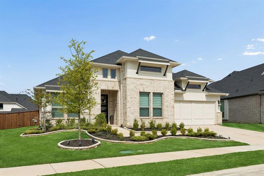 Front exterior of a new home in Dominion of Pleasant Valley, Wylie, TX, highlighting curb appeal (Image 2). Front exterior of a new home in Dominion of Pleasant Valley, Wylie, TX, highlighting curb appeal (Image 2).