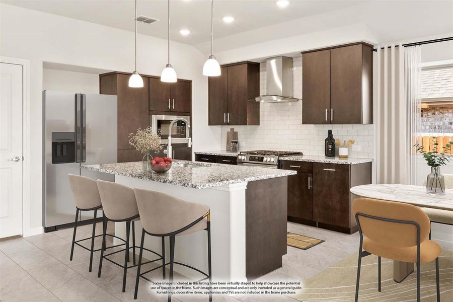 Kitchen with dark brown cabinets, granite island with seating, stainless steel appliances, and white subway tile backsplash