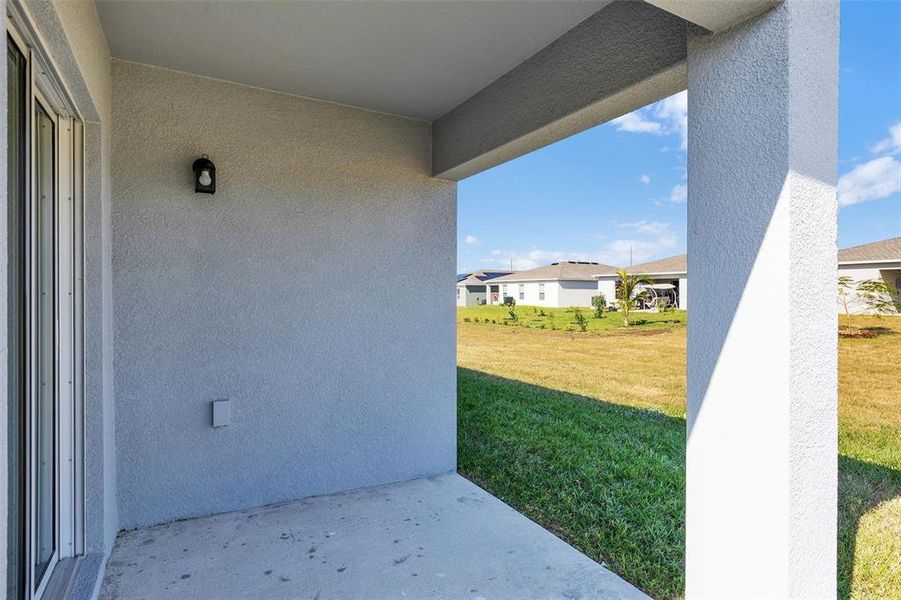 Exterior details and patio area of a home in Stone Ridge, Sebring (Image 11).