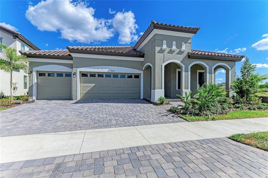 Front exterior of a new home in Hawkstone, Lithia, FL, highlighting curb appeal (Image 2).