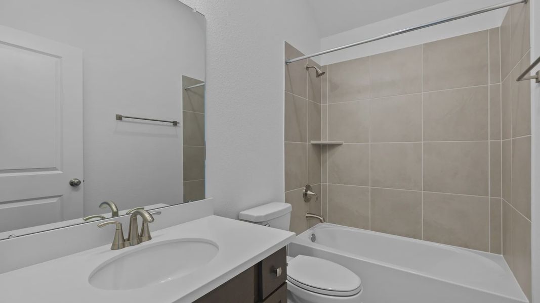 Furnished interior view inside a new home in Sunterra, Katy (Image 7).