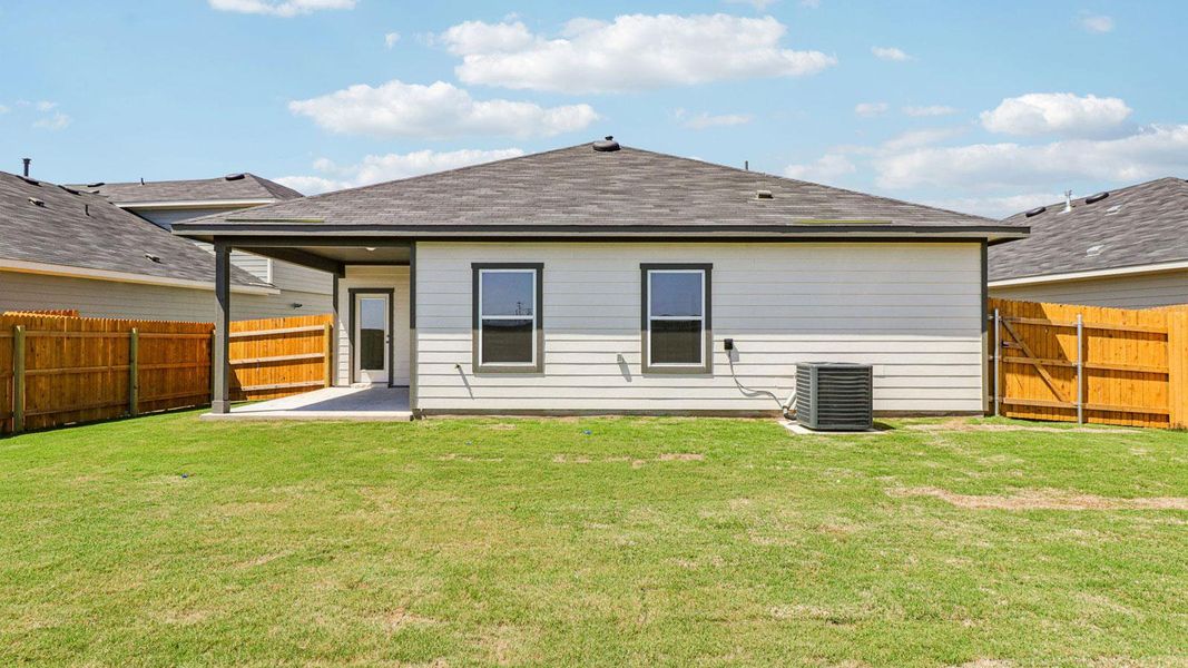 Exterior details and patio area of a home in Monarch Ranch, Manor (Image 17).
