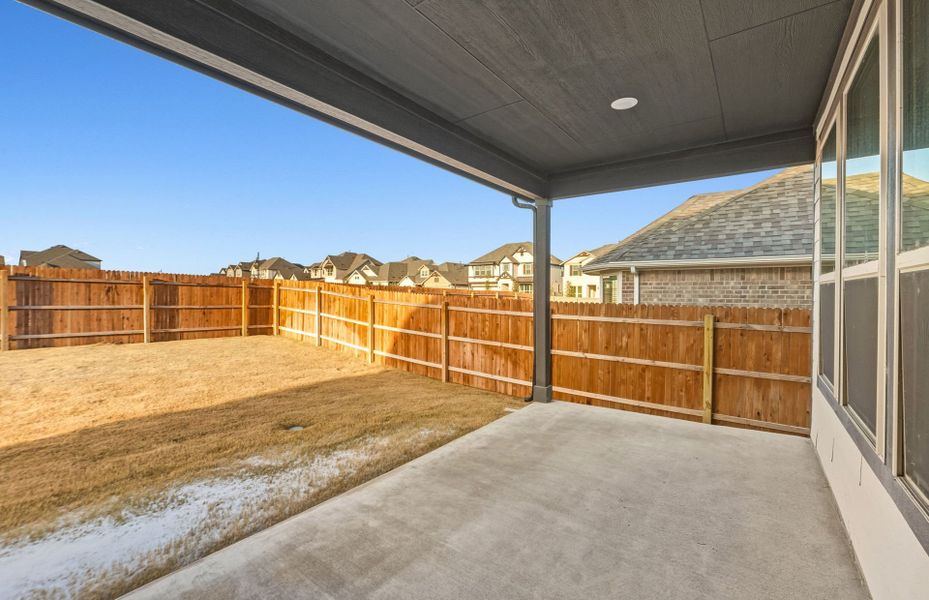 Exterior details and patio area of a home in Saddleback at Santa Rita Ranch, Liberty Hill (Image 25). Exterior details and patio area of a home in Saddleback at Santa Rita Ranch, Liberty Hill (Image 25).