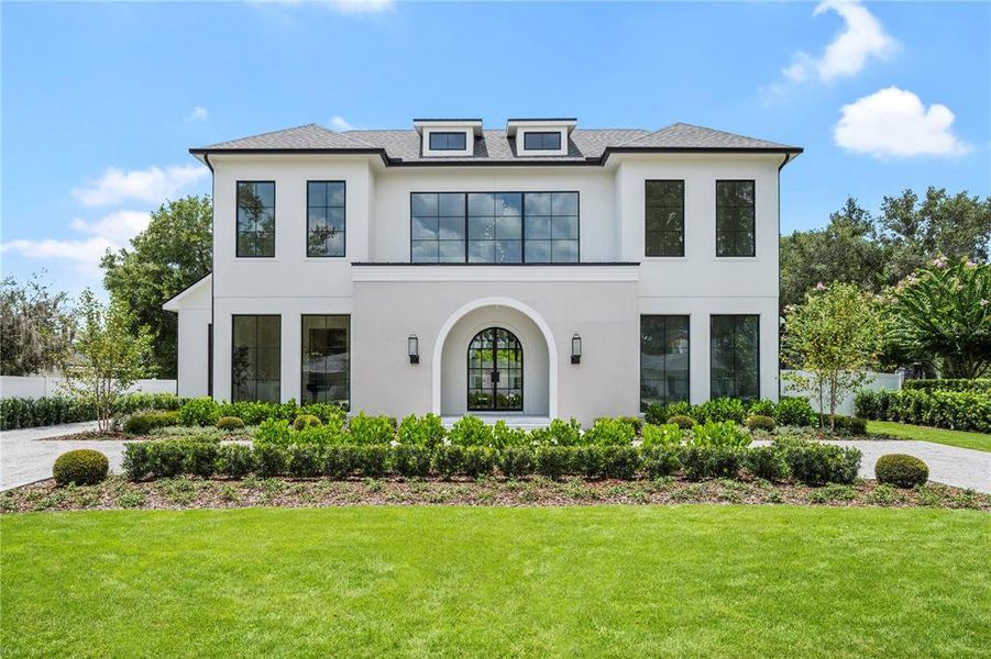 Front exterior of a new home in , Winter Park, FL, highlighting curb appeal (Image 27). Front exterior of a new home in , Winter Park, FL, highlighting curb appeal (Image 27).