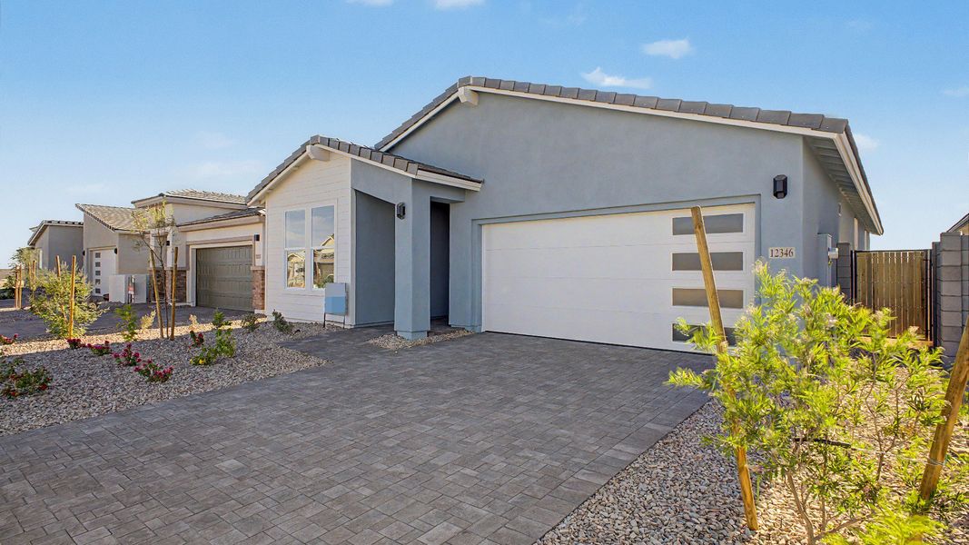 Front exterior of a new home in Teravalis, Buckeye, AZ, highlighting curb appeal (Image 21). Front exterior of a new home in Teravalis, Buckeye, AZ, highlighting curb appeal (Image 21).