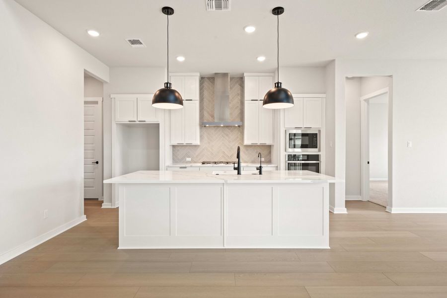 Furnished interior view inside a new home in Wolf Ranch, Georgetown (Image 13).